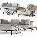 Modern Gray Sectional Sofa With Throw Pillows Knitted Blanket And Wooden Side Tables
