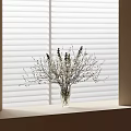 Clear Glass Vase With White And Purple Flowers On Windowsill Against Blinds Background