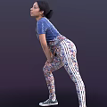 Stylish Woman Wearing Blue Adidas T Shirt And Floral Print Leggings Bending Forward