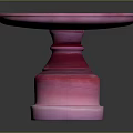 Pink Round Pedestal Table With Modern Smooth Surface And Decorative Base