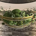 Hanging Landscape Sculpture With Golden Metal Frame Green Spherical And Small Plants Against Stone Wall