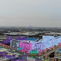 Aerial Planning of Industrial Zone With White Multi Story Buildings Blue Roofs And Greenery
