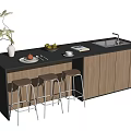Kitchen Bar with Black Countertop Wooden Cabinets Three Bar Stools Plant Fruit Bowl and Sink