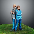 Two Boys With Crossed Arms Standing On Grass In Hoodies And Jeans