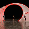 Stylish Event Entrance With White Curved Structure Red LOGO And People Taking