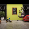 Kids Tricycle With Blue Seat Red Handlebar Yellow Wall Chalkboard And Green Plant