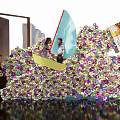 Stunning Floral Installation With Vibrant Colorful Flowers At Entrance And People Standing