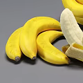 Fresh Ripe Yellow Banana Bunches With a Peeled One on Gray Background