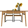 Modern Wooden Dining Table Set With Rattan Back Chairs Black Metal Frames And Sunflower Vase