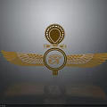 Sculpture Carving with Golden Wings Circular Emblem and Ornate Top Design