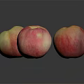 Three Fresh Pink and Yellow Peaches on Dark Background with Reflections