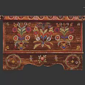 Colorful Floral Painted Wooden Chest With Decorative Patterns And Carved Feet