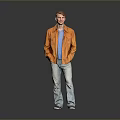 A Man Standing In Gray Background Wearing Orange Jacket Blue T-shirt And Light Blue Jeans