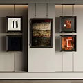 Framed Decorative Paintings With Various Designs And Colors Hanging On Wall