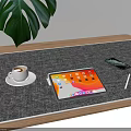 Modern Tablet Workspace on Wooden Table with Coffee Cup Smartphone Pen and Green Leaf Plant