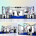 Modern Exhibition Booth Design With Display Counters Posters And Staff Members 3d model