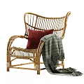 Rattan Leisure Chair with Red Cushion Striped Blanket and Matching Ottoman for Cozy Seating