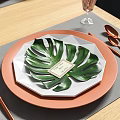 Elegant Dining Table Setup With Leaf Pattern Plates Copper Cutlery And Glass Cups