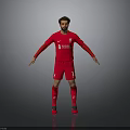 Liverpool Football Player Wearing Red Jersey With Team Logo And Shorts