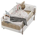 Cozy White Baby Crib With Wooden Legs Soft Pillows Plush Rabbit Toys And Gray Blanket