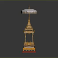 Traditional Golden Architectural Structure With White Umbrella Top Red Base And Intricate Decorative Details