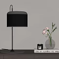 Modern Table Lamp With Silver Base Gray Shade And Glass Vase With Pink Flowers