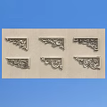 Six Intricate Metal Carved Corner Decorations Showcased On Light Background Board