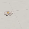 Flower Shaped Decorative Pillow with Beige Petals and Yellow Center on Light Colored Tiled Floor