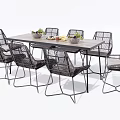 Modern Wooden Dining Table Set With Rattan Chairs And Decorative Fruit Bowls