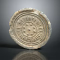 Ancient Decorative Tile With Intricate Floral Carving Round Shape And Vintage Texture