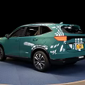 Green Modern SUV Showcased On Round Display Platform With Black Background