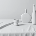 Two Glass Wine Bottles And Whiskey Glass With Drink On White Tablecloth