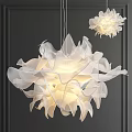 Modern White Petal Design Chandelier With Lightweight Material And Warm Light On Dark Wall