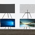 Modern Televisions on Tripods Some Displaying Scenic Images Against White Wall