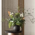 Decorative Black Vase With Green Plants Orange Blooms White Flowers And Twigs On Dark Table