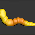 Colorful Gummy Worms With Red Yellow Green Smiley Face Shapes On Black Surface