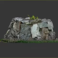 Natural Stone Pile Structure With Green Grass And Small Plant On Top