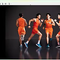 Dynamic Men Running in Orange Sportswear on Gray Reflective Background