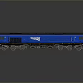 Blue InterCity Model Train Diesel Locomotive With Yellow Front On Reflective Surface
