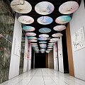Elevator Hallway with Colorful Decorative Umbrellas on Ceiling Wall Paintings Marble Walls and Tile Flooring