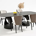 Modern Black Oval Dining Table Set With Brown Beige Chairs Glass Vase And Fruit Bowl