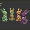 Colorful Rabbit Figurines in Green Red Yellow and Gray on Reflective Surface