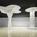 Modern Sculptural Columns With Flowing And Stacked Designs In Illuminated Interior Space 3d model