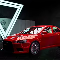 Red Sports Car Displayed With White Neon Triangle Light In Dark Background