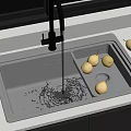 Stainless Steel Kitchen Sink With Running Water And Pears On White Countertop