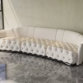 Curved Cream Fabric Sofa With Tufted Diamond Pattern In Modern Marble Interior 3d model