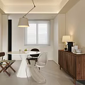 Modern Restaurant Interior With White Round Dining Table Wooden Cabinet And Hanging Lamp