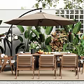 Stylish Outdoor Table with Wooden Chairs Large Umbrella and Green Plants in Patio