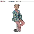 Girl Sitting On White Stool Wearing Blue Floral Jacket Pink Top And White Shoes