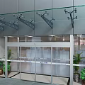 Modern Commercial Entrance With Glass Doors Facade Metal Brackets And Potted Plants